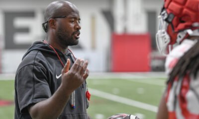 Arkansas Razorbacks coach Sam Pittman watching practice Thursday morning on the indoor practice field