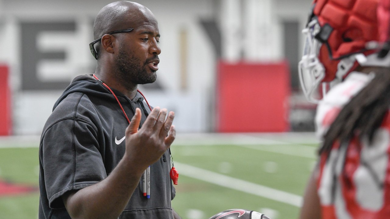 Arkansas Razorbacks coach Sam Pittman watching practice Thursday morning on the indoor practice field
