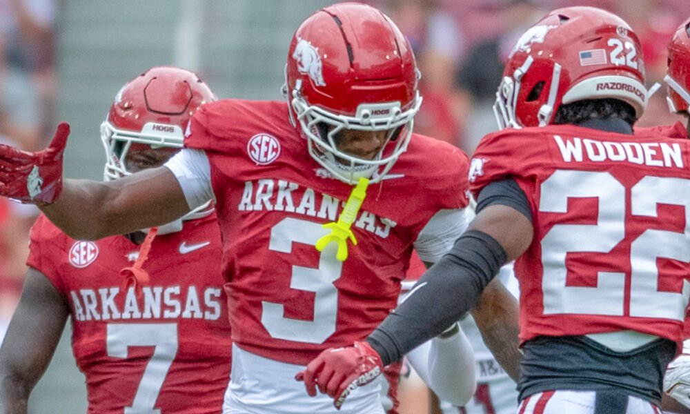 Arkansas Razorbacks defensive back Larry Worth celebrates a play with Caleb Wooden against the Alabama A&M Bulldogs