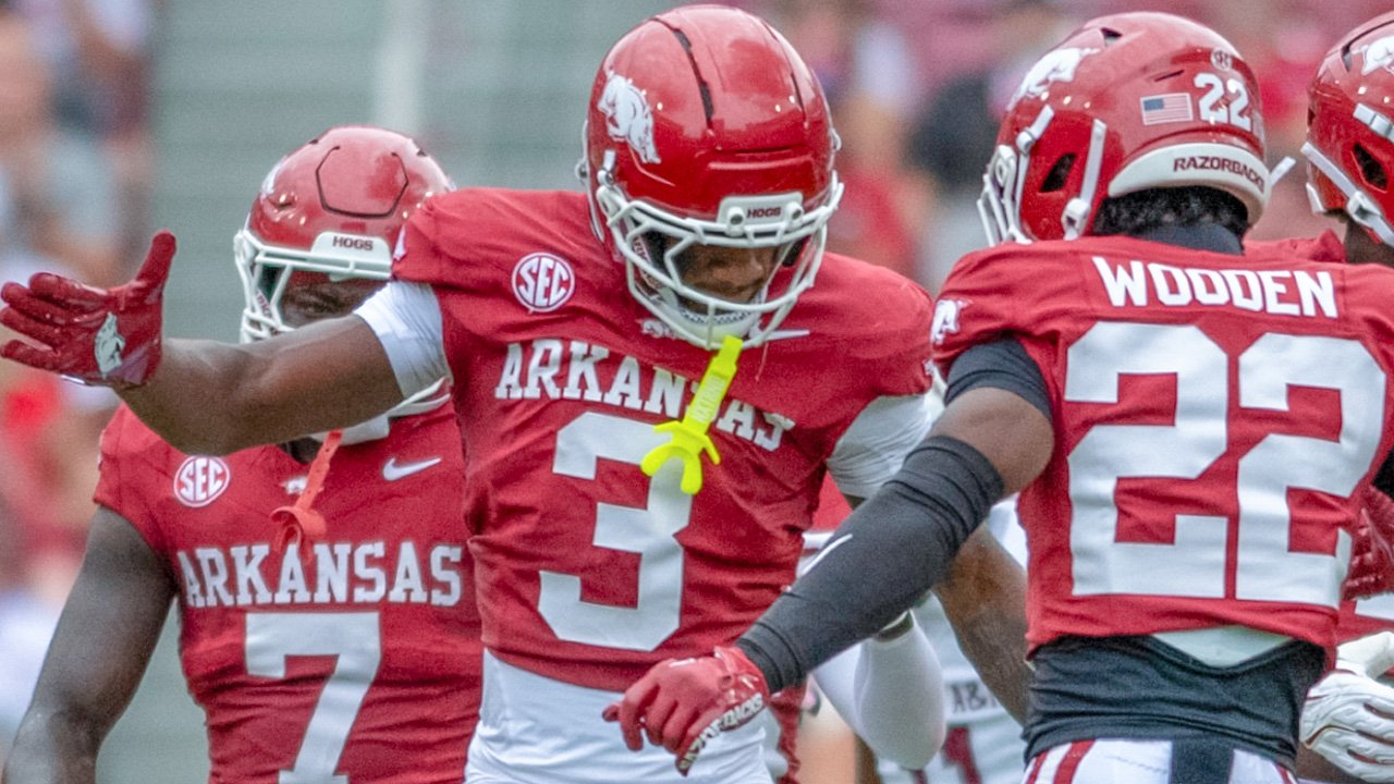 Arkansas Razorbacks defensive back Larry Worth celebrates a play with Caleb Wooden against the Alabama A&M Bulldogs