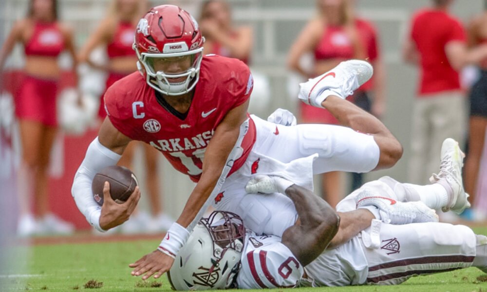 Arkansas Razorbacks quarterback Taylen Green stretches for yardage on a play against Alabama A&M