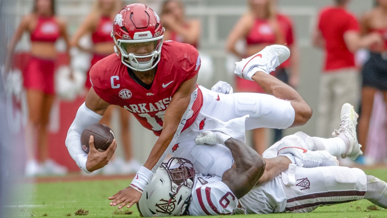 Arkansas Razorbacks quarterback Taylen Green stretches for yardage on a play against Alabama A&M