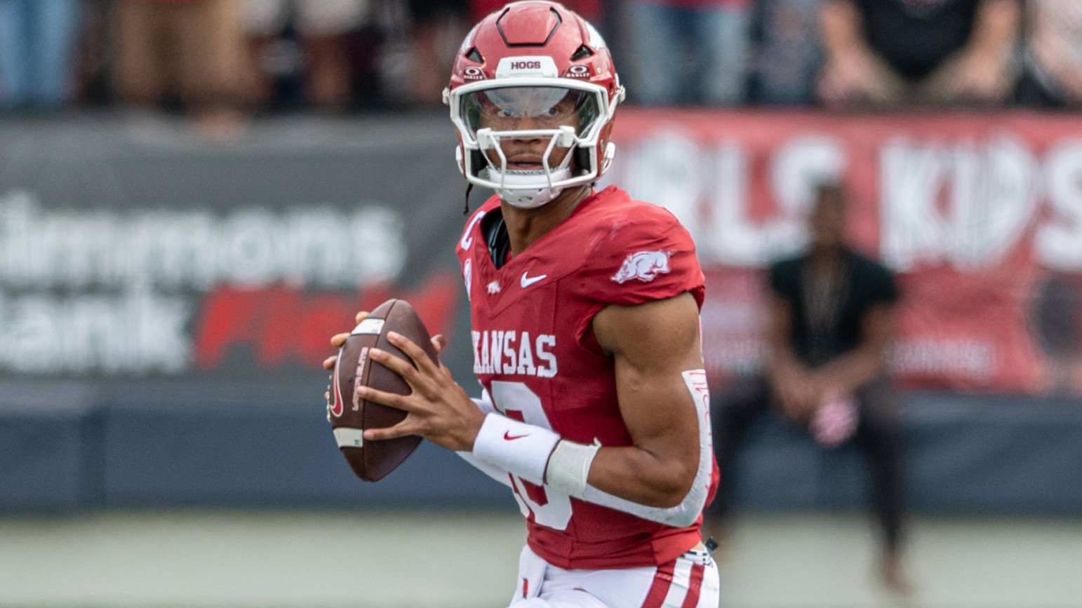 Arkansas Razorbacks quarterback Taylen Green dropping back to pass against the Arkansas State Red Wolves
