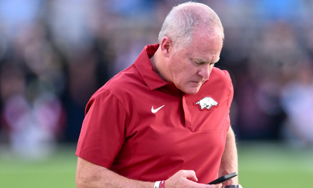 Arkansas Razorbacks athletics director Hunter Yurachek on the field before a game with the Ole Miss Rebels
