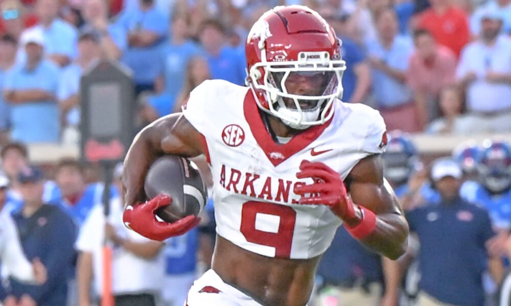 Arkansas Razorbacks wide receiver O'Mega Blake running after making a catch against the Ole Miss Rebels