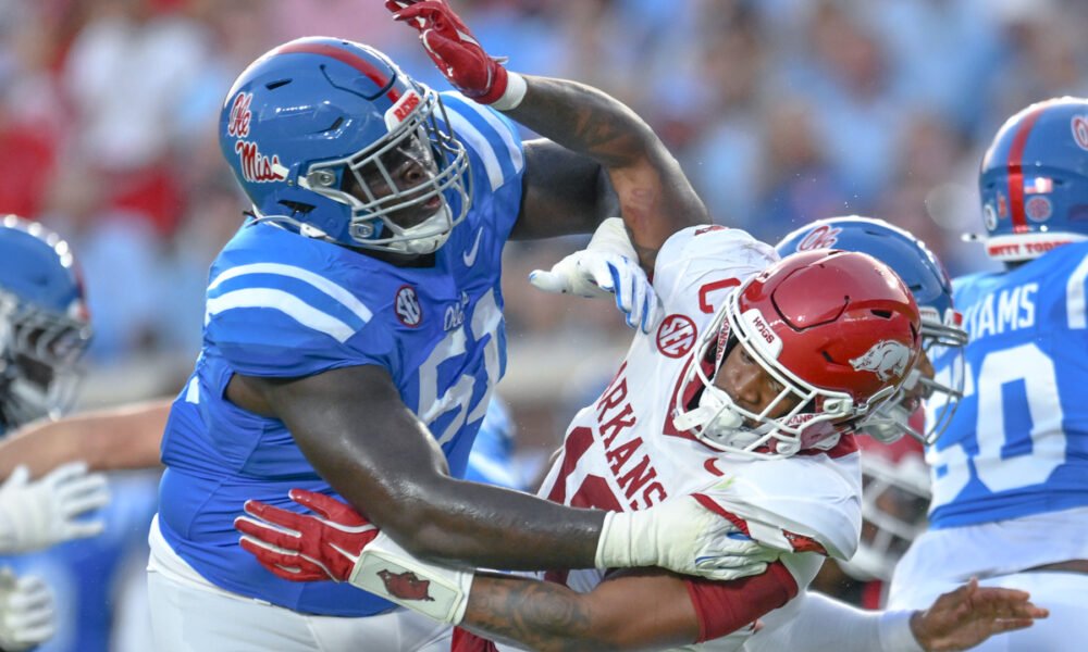 Arkansas Razorbacks linebacker Xavian Sorey gets blocked in game against the Ole Miss Rebels