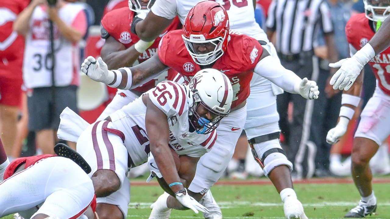 Arkansas Razorbacks defensive lineman Quincy Rhodes making a tackle against Alabama A&M