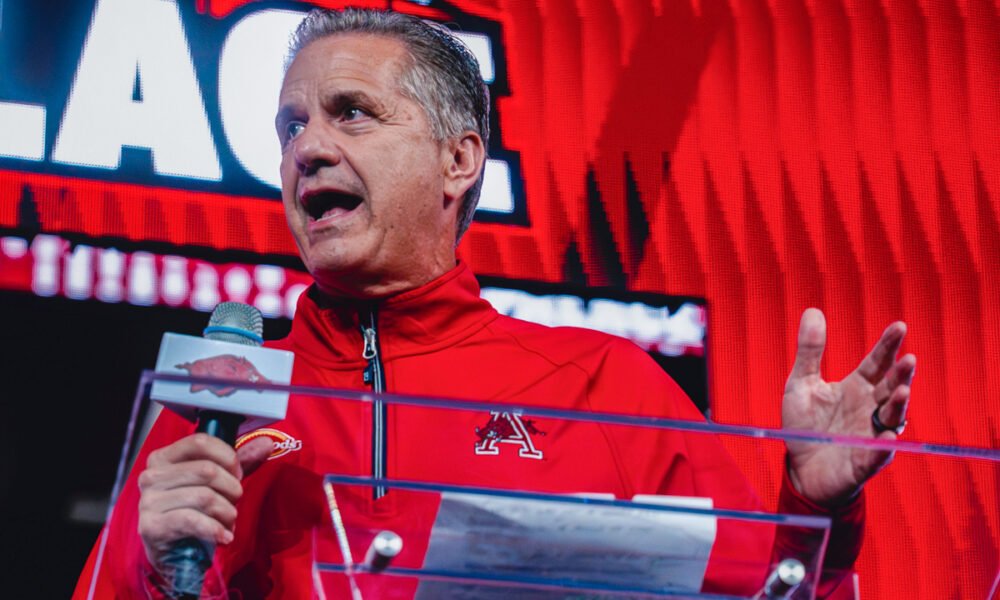 Arkansas Razorbacks coach John Calipari speaking to the crowd at Bud Walton Arena for the Primetime at the Palace event