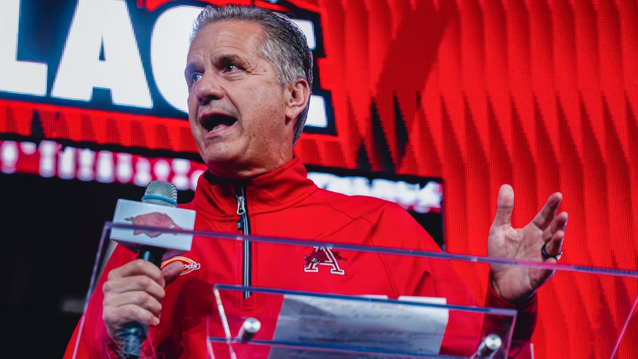 Arkansas Razorbacks coach John Calipari speaking to the crowd at Bud Walton Arena for the Primetime at the Palace event